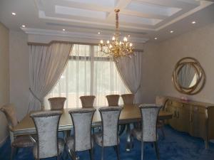 Curtains, Sheers with Pelmet, Carpet & Wallpaper of Dining Area in Fujairah Villa projects