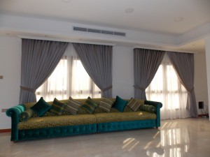 Curtains with Sheers & Sofa of Living Area in Mezhar Dubai
