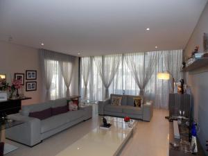 Sheer Curtains & Upholstery of Sofa of Living Area in Umm Sequiem, Dubai & (1)